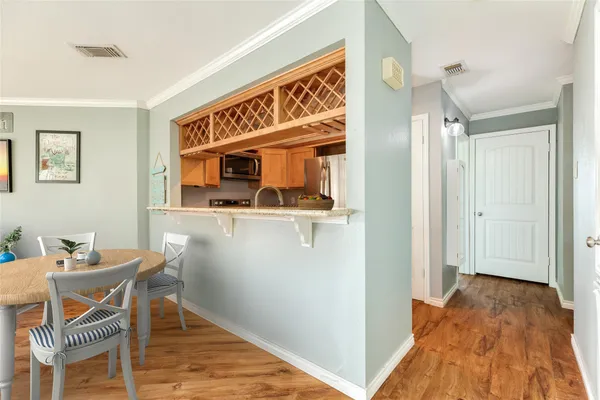 a dining room with table and chairs