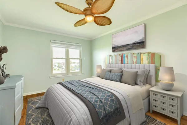 a bedroom with a bed and a chandelier