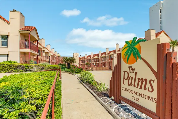 a view of a street with a building in the background