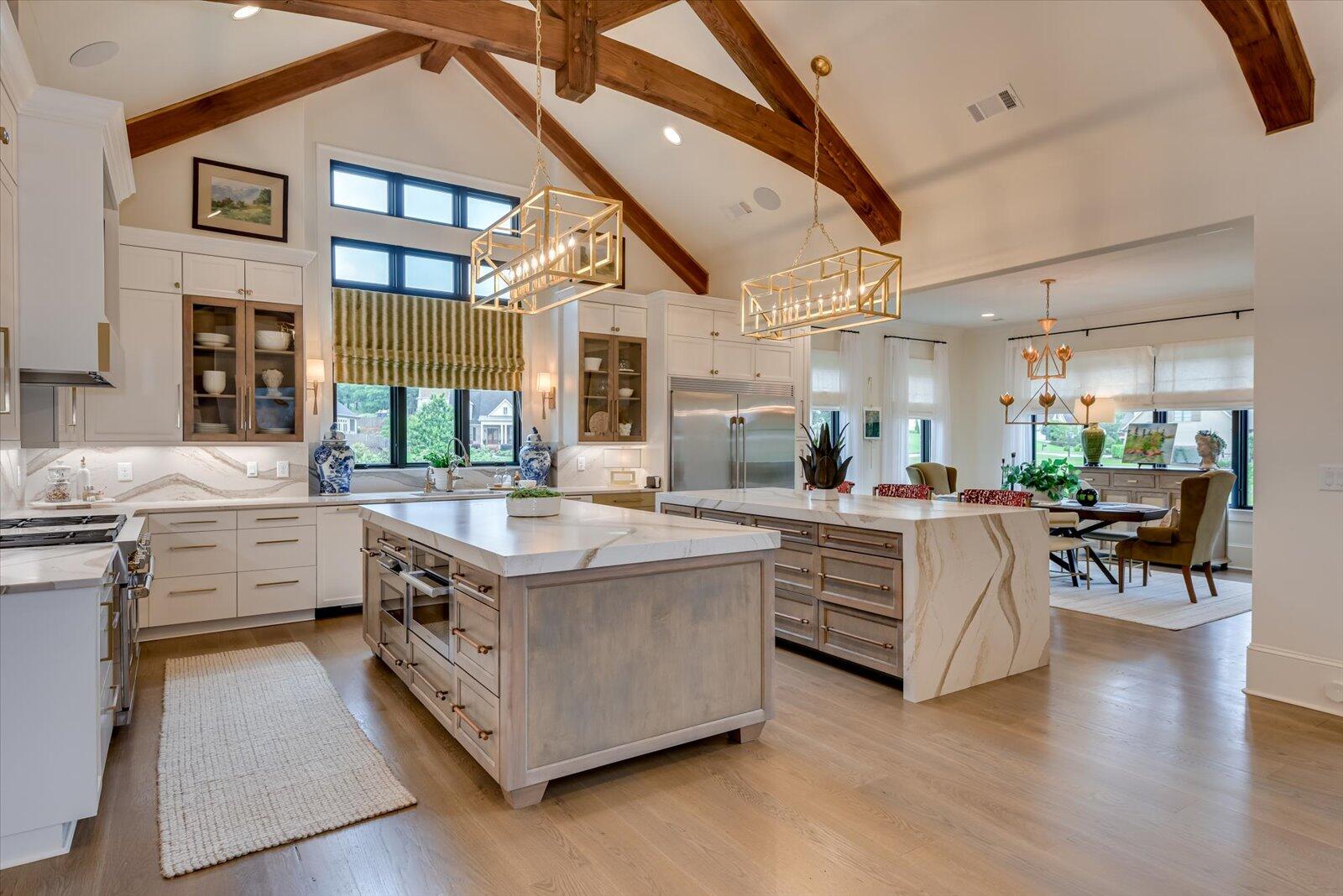 2025 Grace Avenue Evans, GA 30809 - Photo 14 of 67 Bespoke commissioned lighting fixture. Two islands with maple cabinets and Quartz countertops.