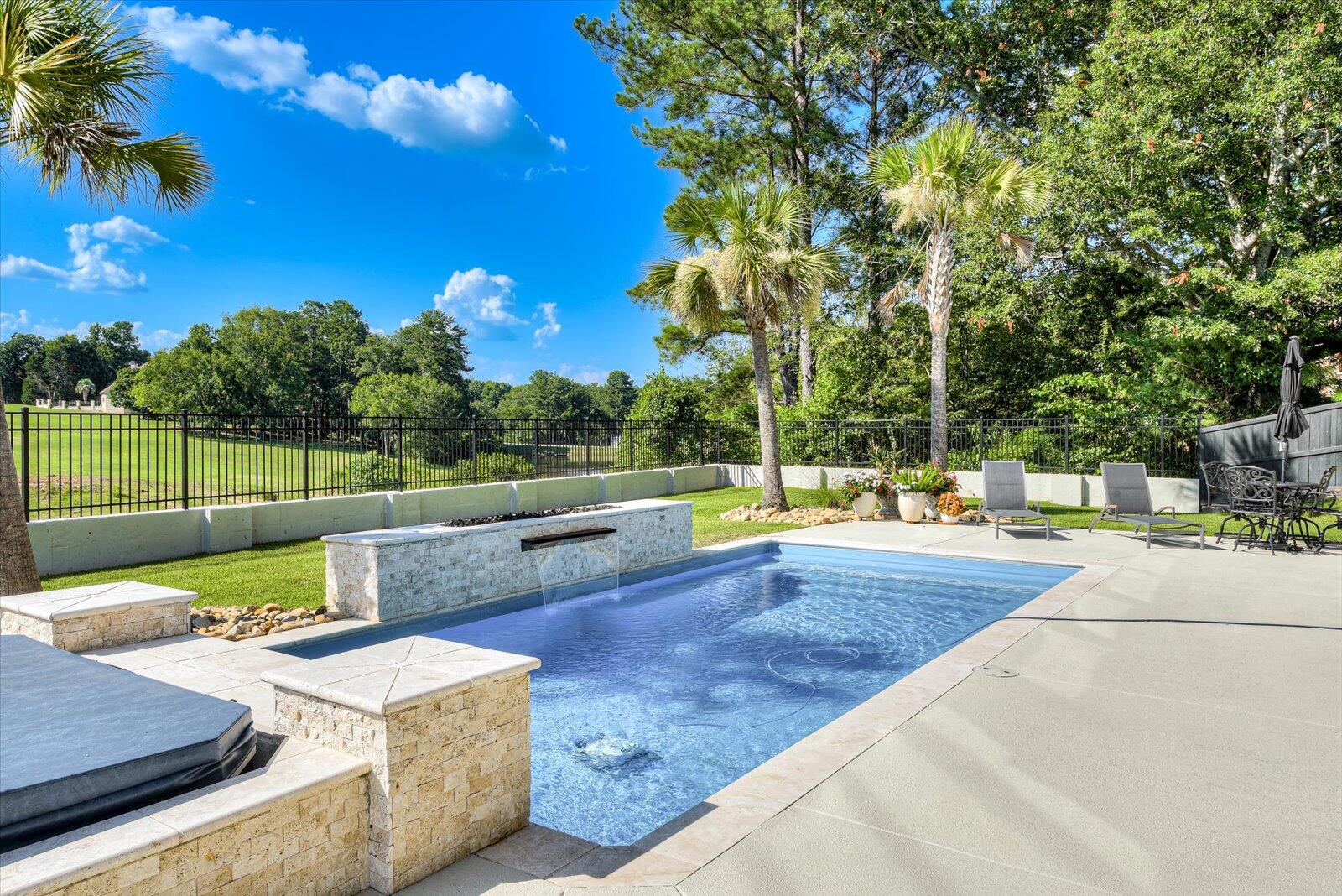 2025 Grace Avenue Evans, GA 30809 - Photo 58 of 67 Pool/Spa- Fiberglass pool by Thursday Pools; “Lil Bob” 13.5 x 27.5; 4 ft to 6 ft deep. Water feature wall w/48’ waterfall and gas fire feature. Pentair salt generator. SuperFlo pump:variable speed.Dual timers. Handheld remote.Cartridge filter.