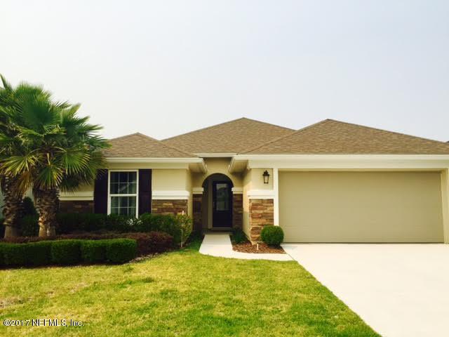 63 Redland Way Jacksonville, FL 32218 - Photo 1 of 14 a front view of a house with a yard and garage