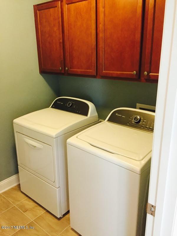 63 Redland Way Jacksonville, FL 32218 - Photo 14 of 14 a utility room with dryer and washer