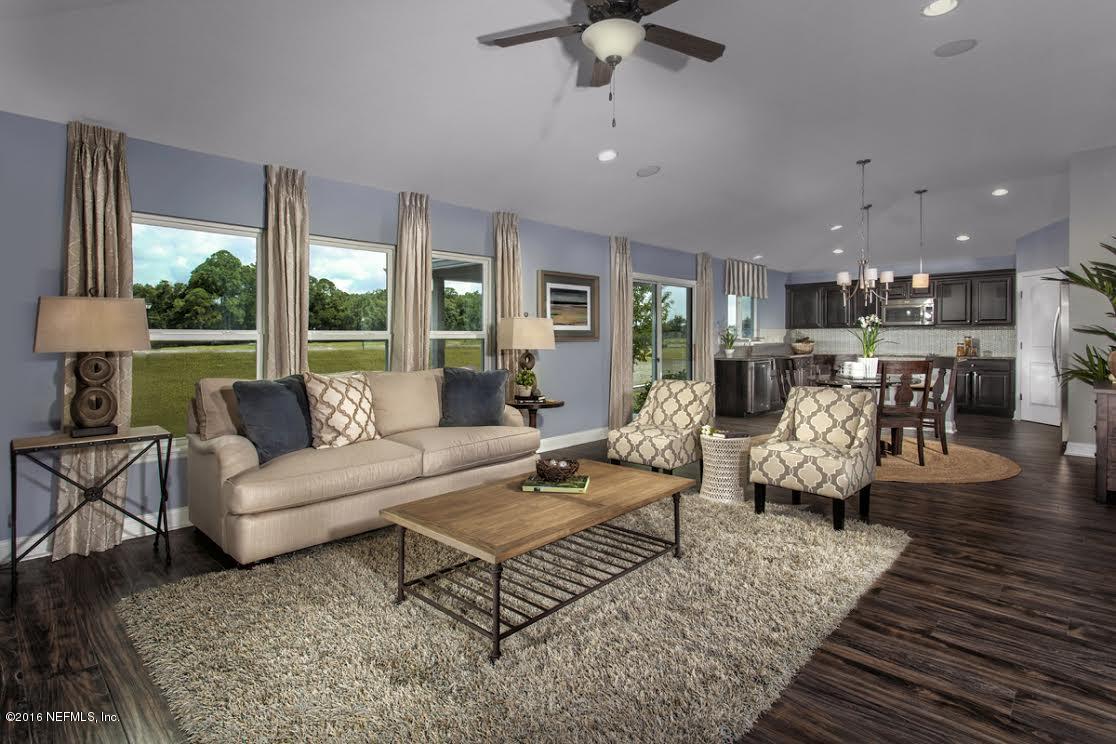 63 Redland Way Jacksonville, FL 32218 - Photo 3 of 14 a living room with furniture and a large window