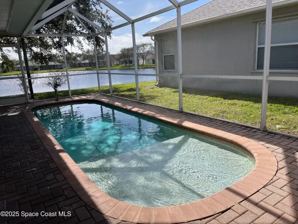 a view of a lake with a yard