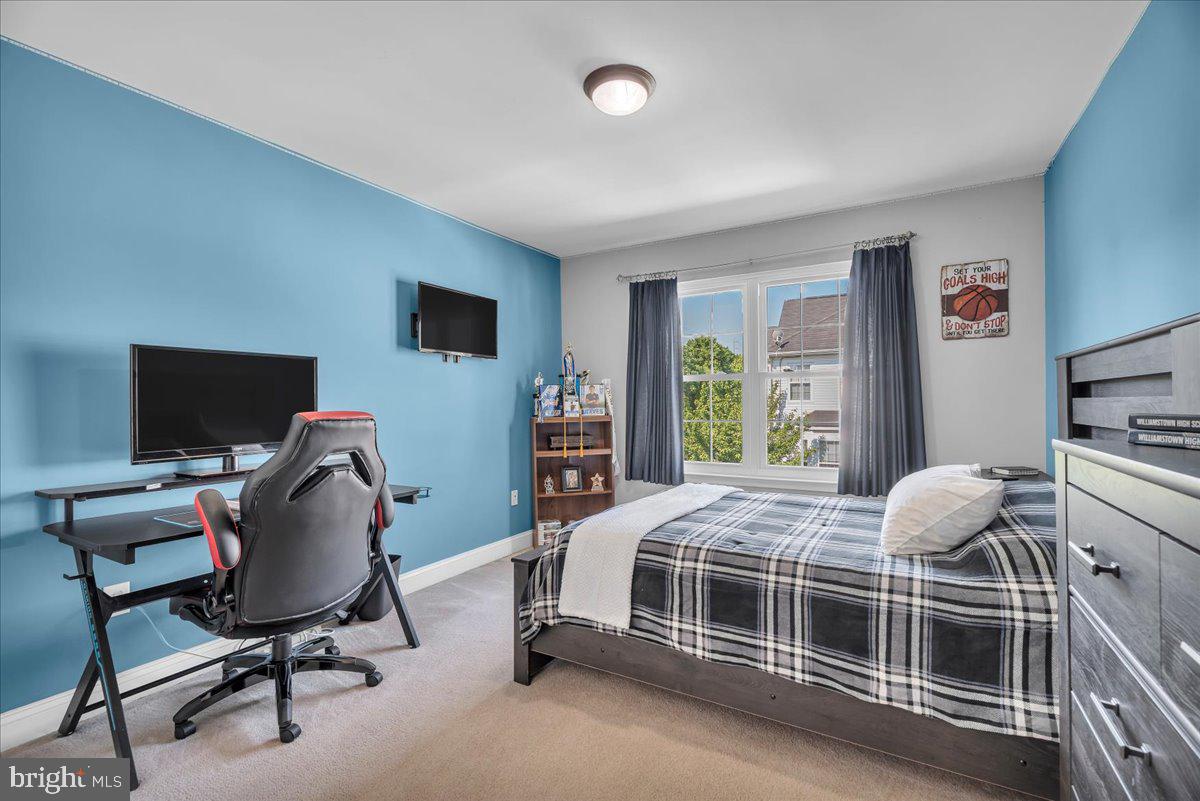 74 Candlewood Road Williamstown, NJ 08094 - Photo 23 of 45 Modern bedroom with vibrant blue walls.