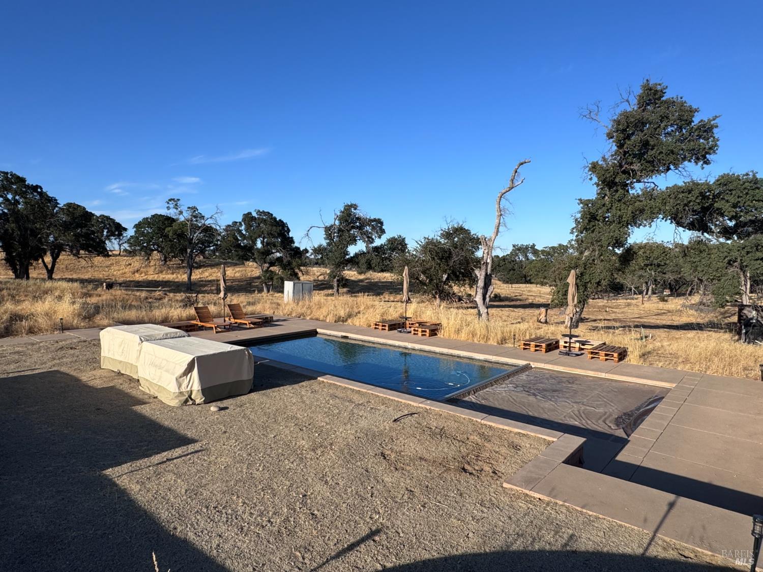 8600 Pleasants Valley Road Winters, CA 95694 - Photo 2 of 35 Large pool with auto cover and deck ready for the summer.
