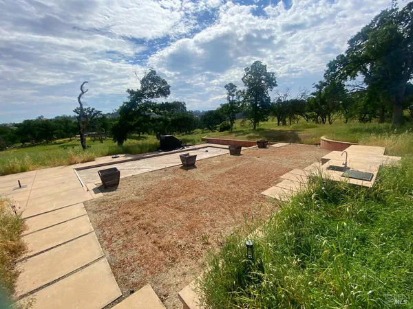 a view of a swimming pool with a patio