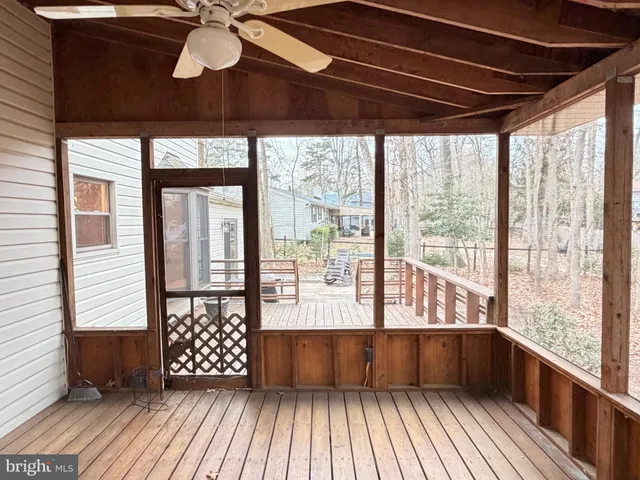 a view of balcony with wooden floor
