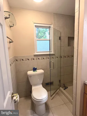 a bathroom with a toilet sink and shower