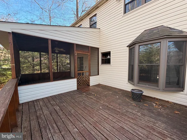 a view of backyard with outdoor seating