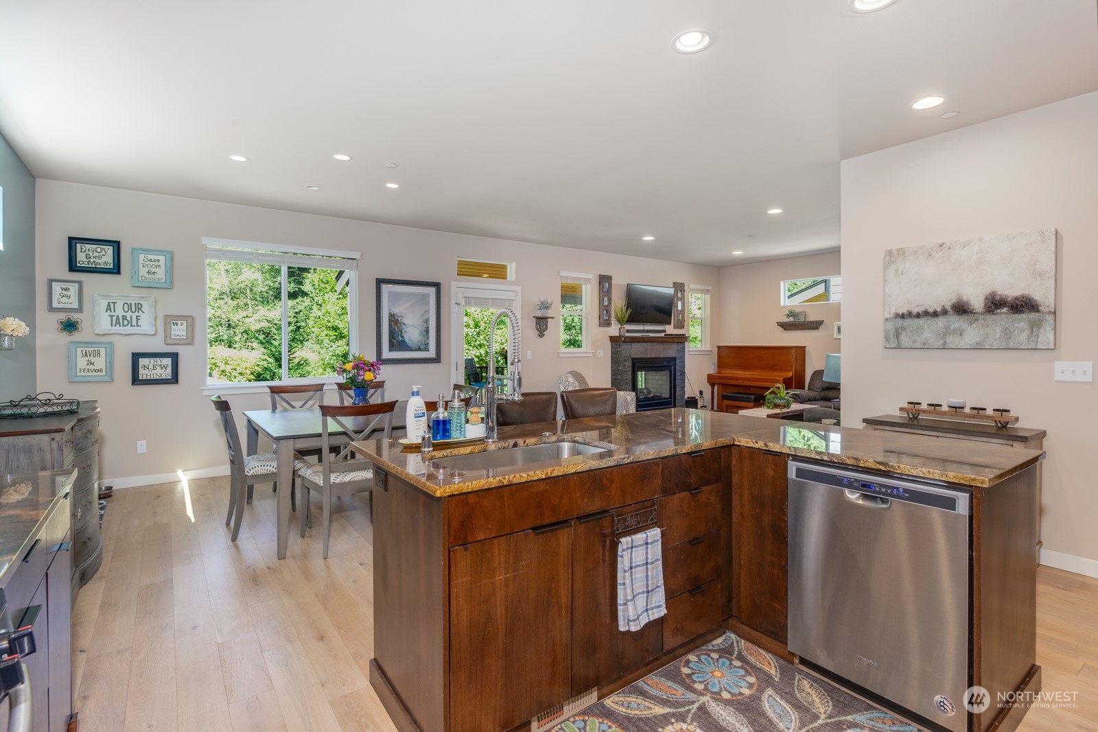 4408 Forest Drive Everett, WA 98203 - Photo 12 of 32 a kitchen with a table chairs stove and cabinets