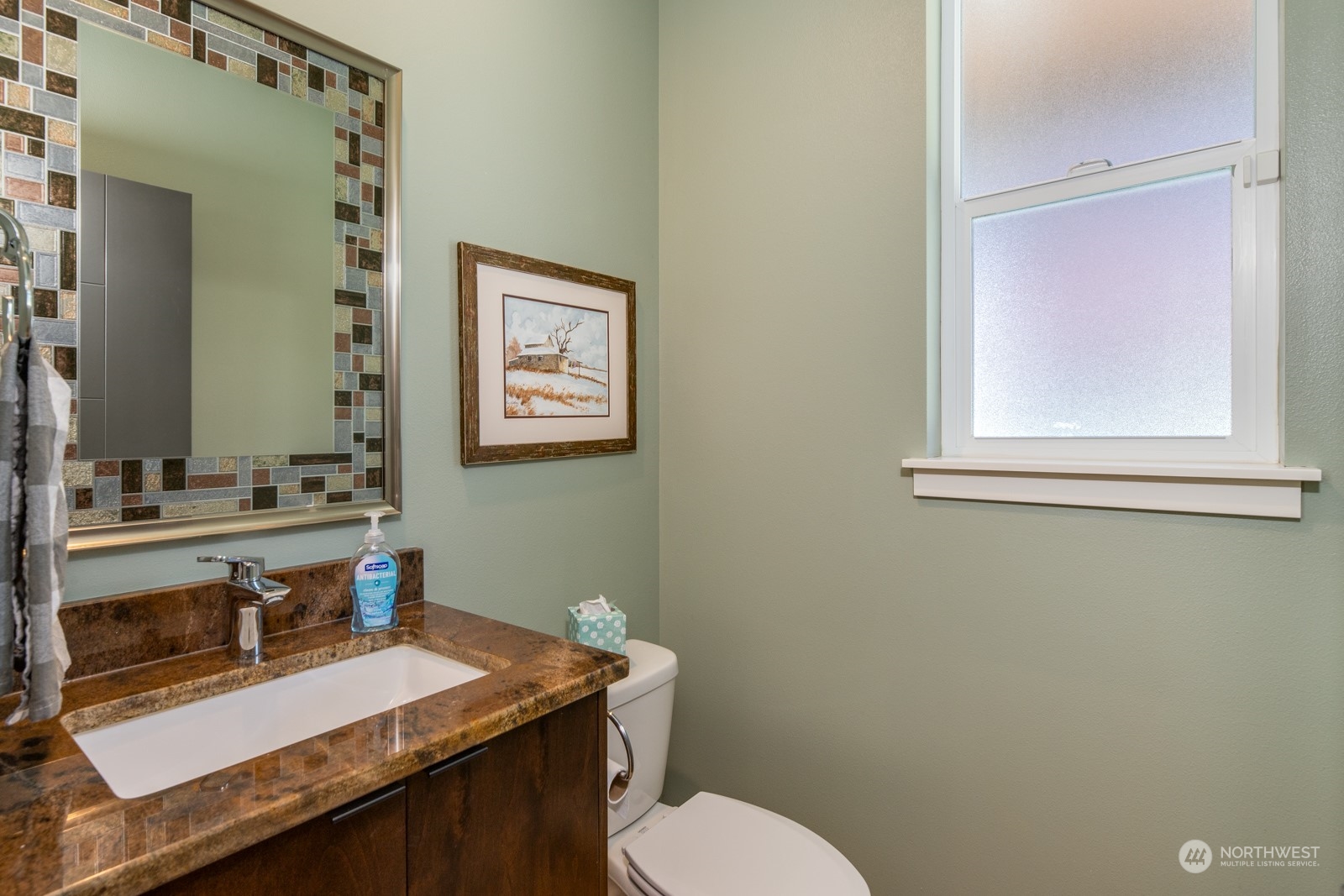 4408 Forest Drive Everett, WA 98203 - Photo 17 of 32 a bathroom with a granite countertop toilet sink and mirror