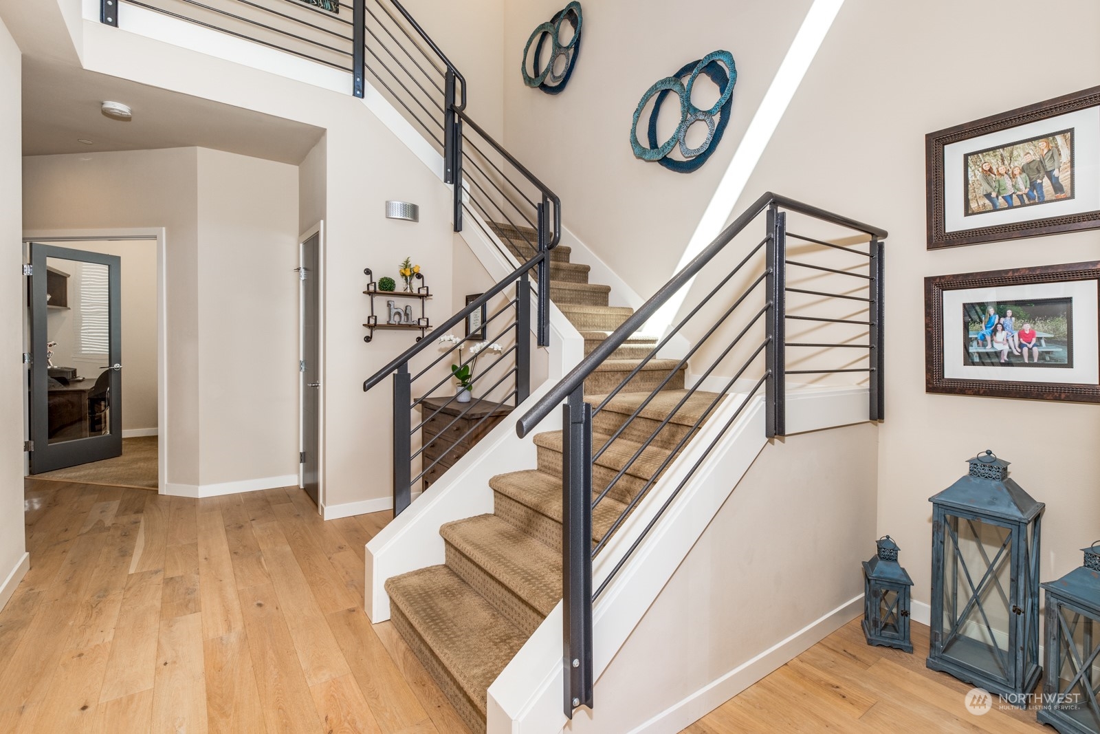 4408 Forest Drive Everett, WA 98203 - Photo 18 of 32 a view of staircase with wooden floor and a chandelier