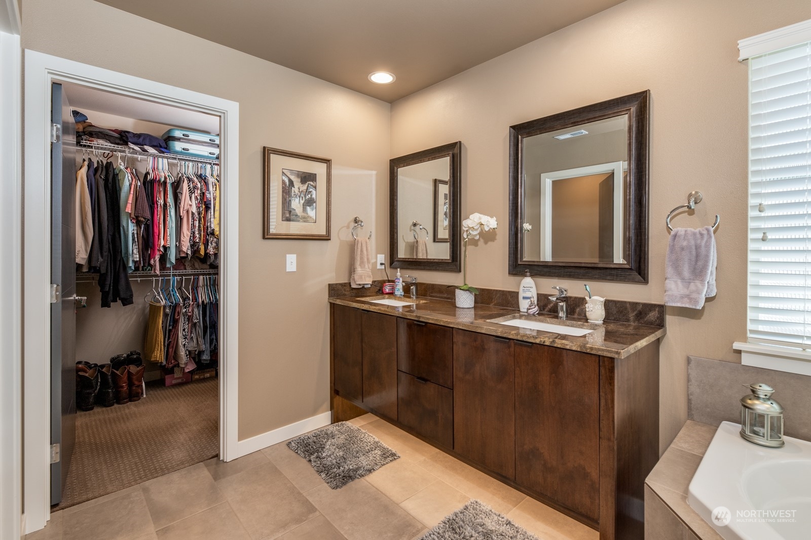 4408 Forest Drive Everett, WA 98203 - Photo 22 of 32 a en suite bathroom with a sink a mirror and a shower