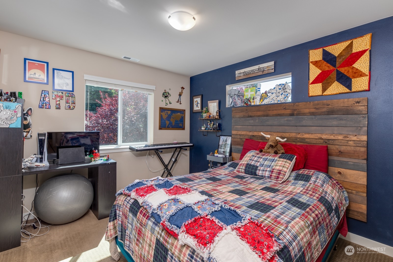 4408 Forest Drive Everett, WA 98203 - Photo 24 of 32 a bedroom with a bed and painting on the wall