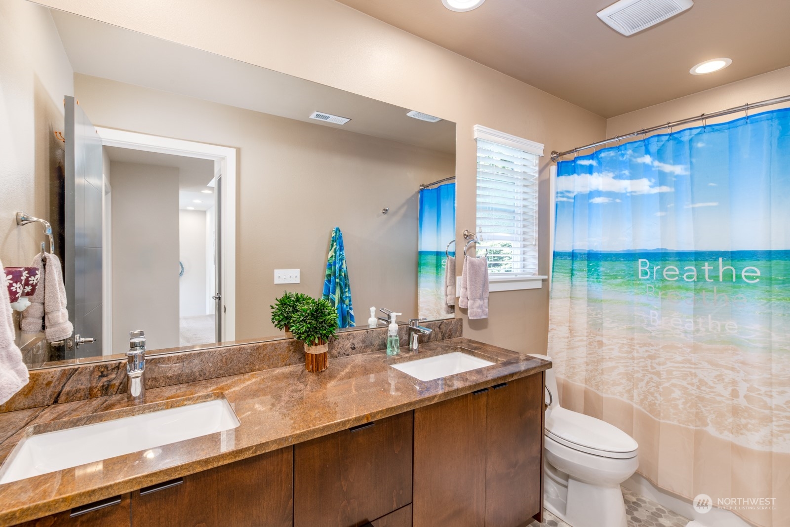 4408 Forest Drive Everett, WA 98203 - Photo 26 of 32 a bathroom with a sink and a mirror