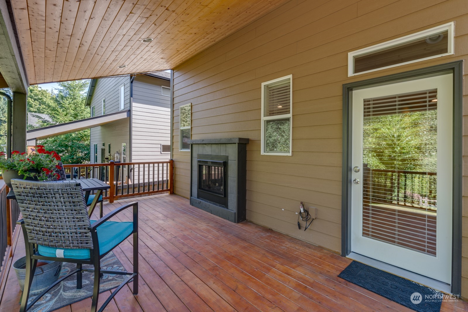 4408 Forest Drive Everett, WA 98203 - Photo 3 of 32 a balcony with furniture and wooden floor