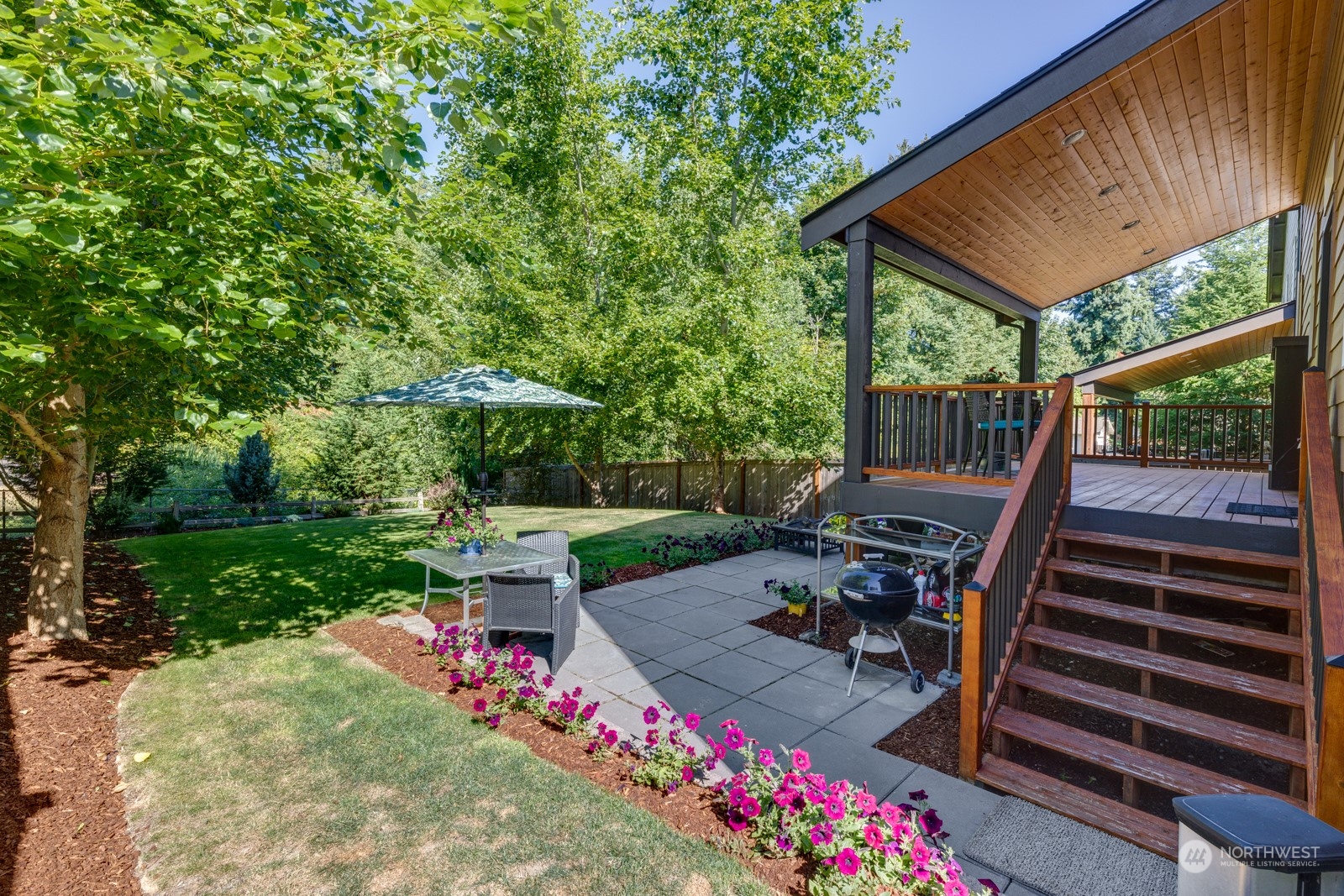 4408 Forest Drive Everett, WA 98203 - Photo 31 of 32 a view of a chair and table in backyard of the house
