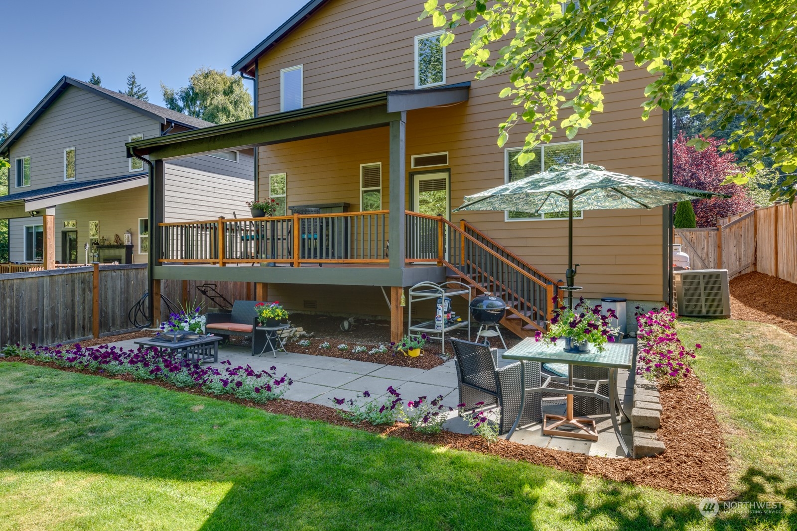 4408 Forest Drive Everett, WA 98203 - Photo 4 of 32 a view of a chair and table in backyard of the house