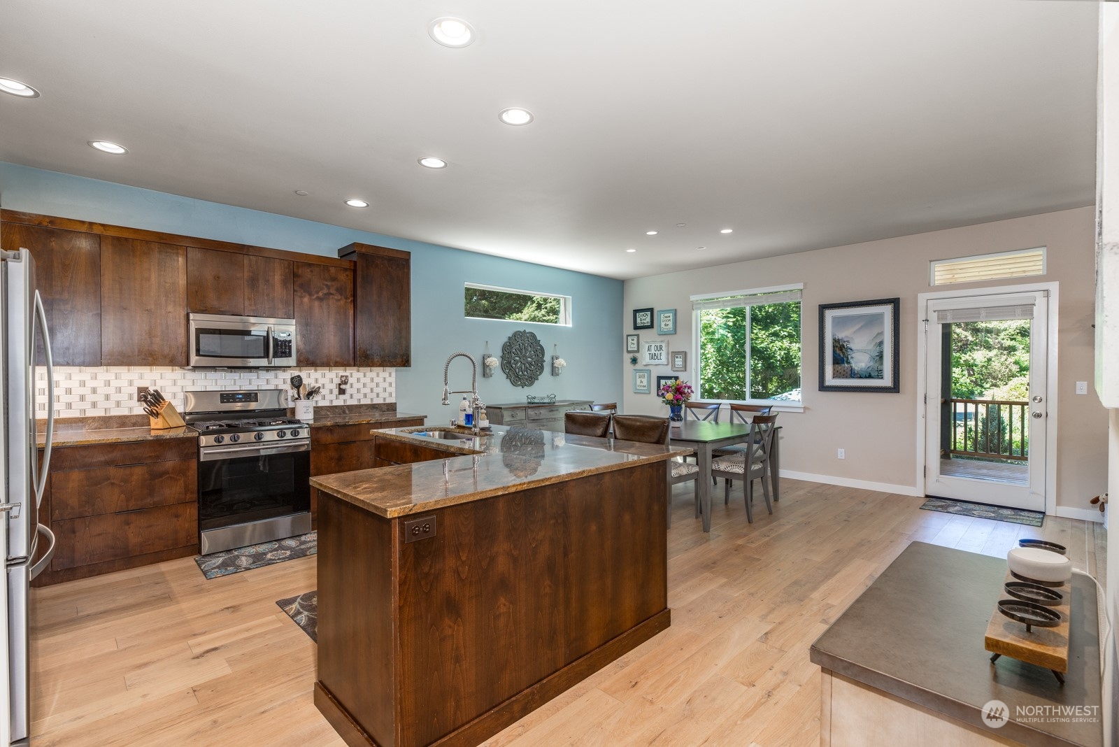 4408 Forest Drive Everett, WA 98203 - Photo 10 of 32 a kitchen with a sink stove and cabinets