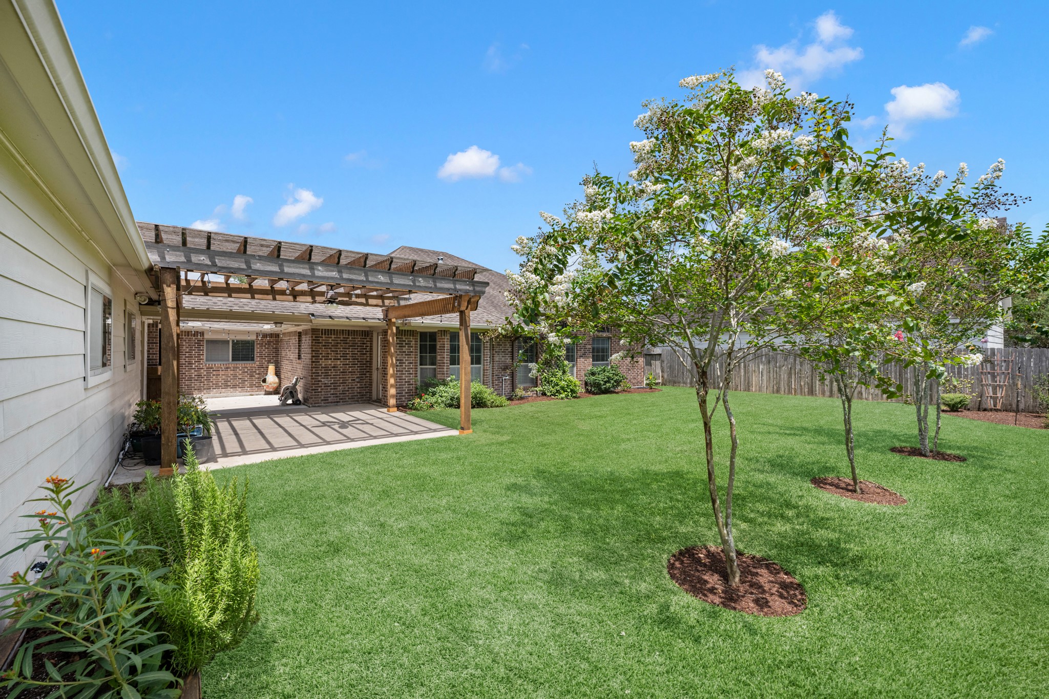 6606 Granbury Road Manvel, TX 77578 - Photo 38 of 48 Spacious fully fenced back yard featuring a wooden pergola.