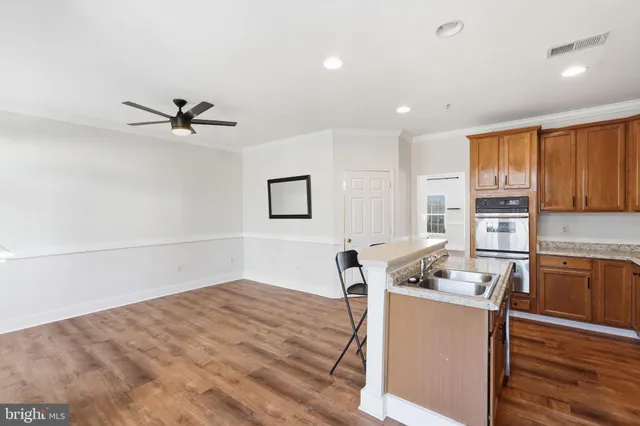 a very nice looking room with a couch and a stove top oven