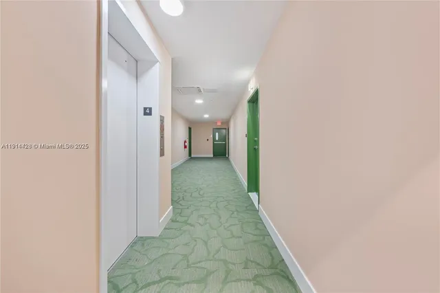 a view of a hallway with a white walls