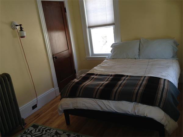 149 Market Street Amesbury, MA 01913 - Photo 11 of 23 a bedroom with a bed and a window