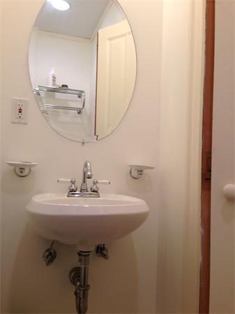 149 Market Street Amesbury, MA 01913 - Photo 17 of 23 a bathroom with a sink a mirror and vanity