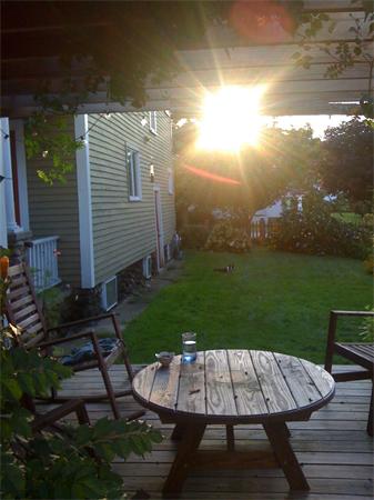 149 Market Street Amesbury, MA 01913 - Photo 23 of 23 a view of a patio with table and chairs with wooden floor and fence
