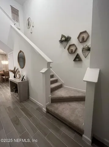 a bathroom with a double vanity sink mirror and shower