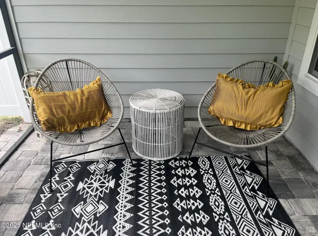 a wooden bench with view of outdoor space
