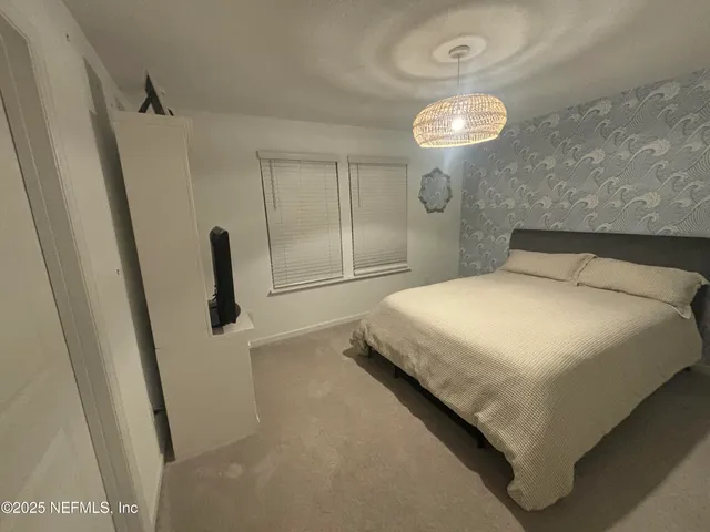 a bathroom with double sink and a mirror