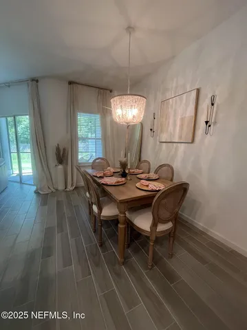 a kitchen with stainless steel appliances granite countertop a refrigerator a stove and a sink