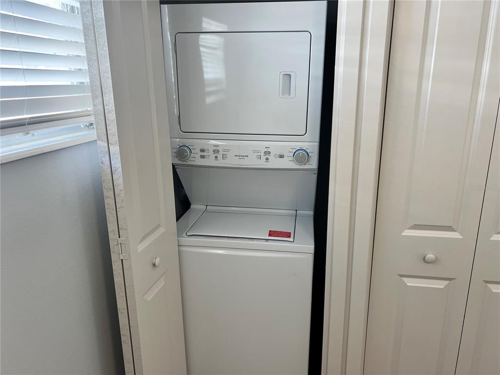 6020 Midnight Pass Road, Unit 32 Sarasota, FL 34242 - Photo 12 of 13 a view of washer and dryer