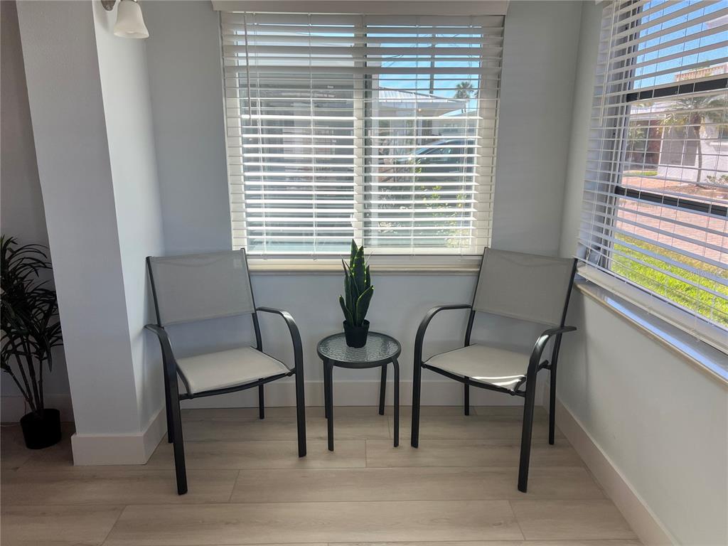 6020 Midnight Pass Road, Unit 32 Sarasota, FL 34242 - Photo 5 of 13 a living room with furniture and a window