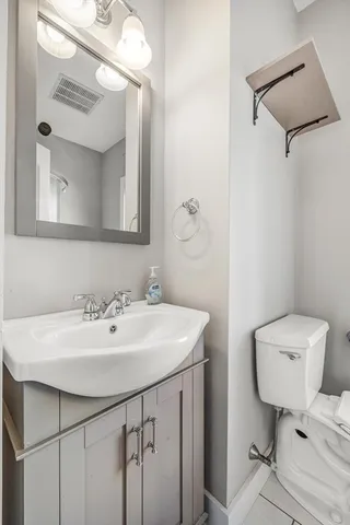 a kitchen with a stove a sink and a window