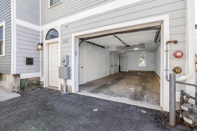 a front view of a building with parking