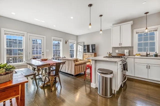 a kitchen with a sink stove and refrigerator
