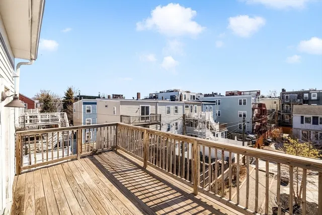 a view of a hallway with wooden floor and entryway