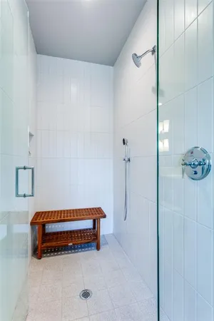 a room with a bed and a shower