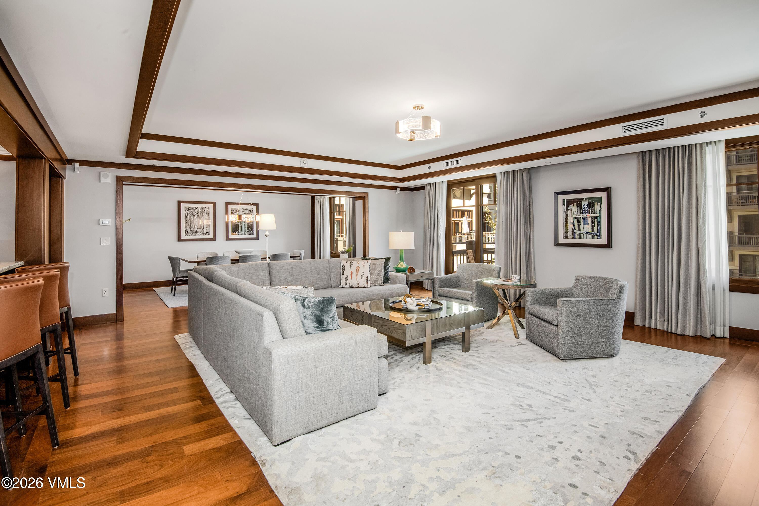1 Vail Road, Unit 5102C Vail, CO 81657 - Photo 1 of 13 a living room with furniture and wooden floor