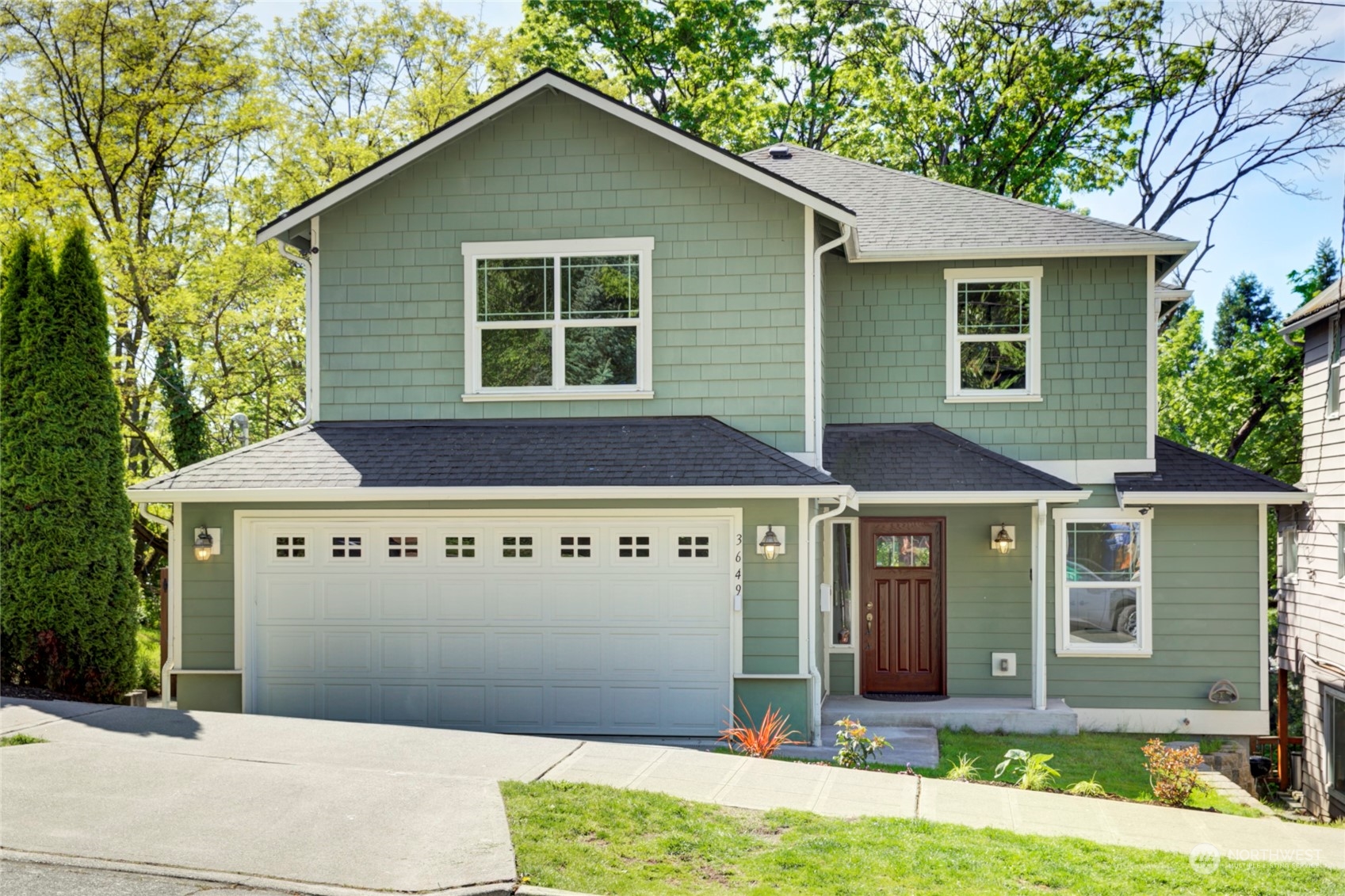 a front view of a house with garden
