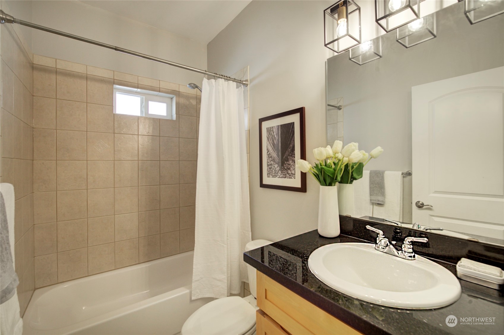 3649 22nd Avenue Southwest Seattle, WA 98106 - Photo 13 of 40 a bathroom with a granite countertop sink a toilet and shower