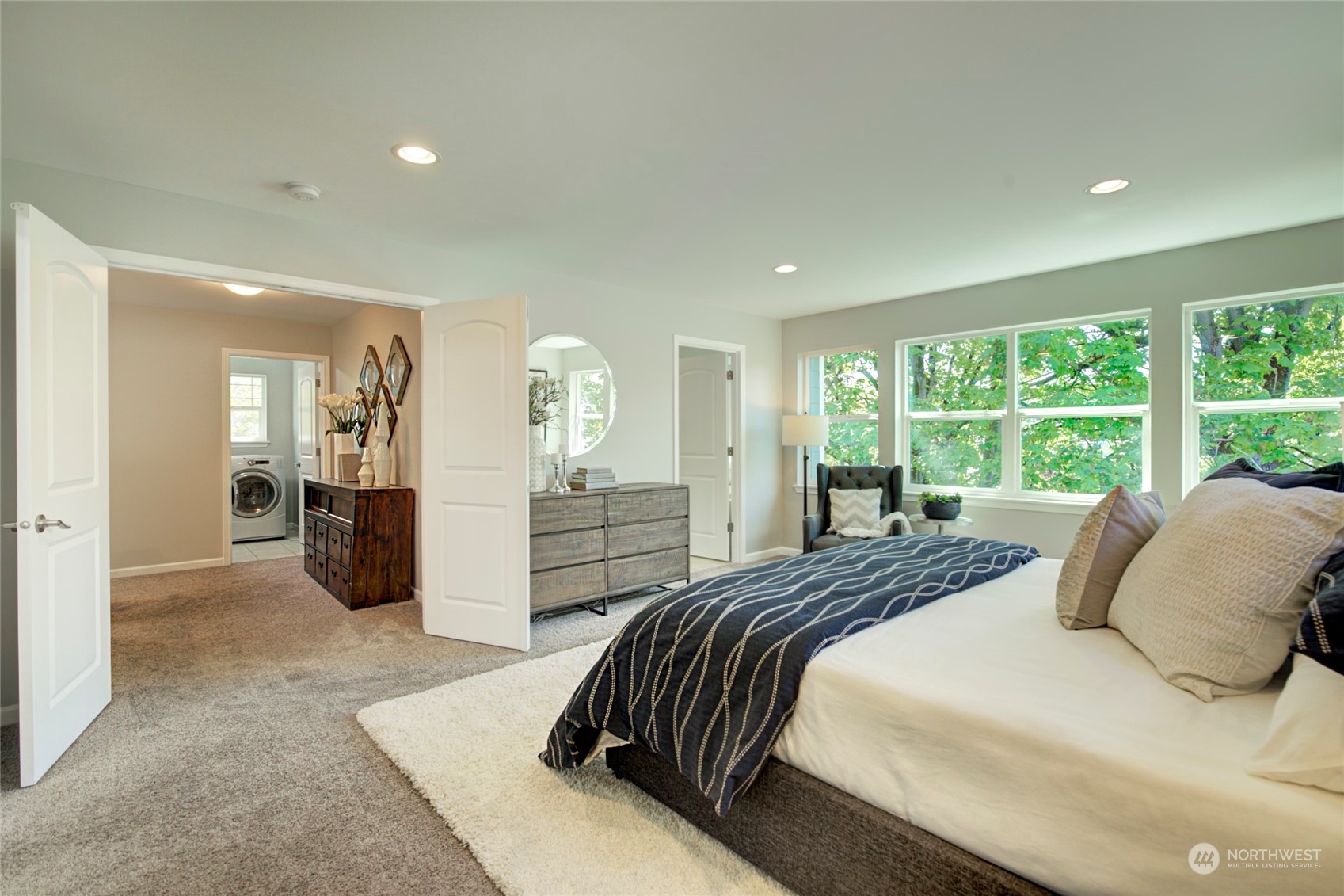 3649 22nd Avenue Southwest Seattle, WA 98106 - Photo 15 of 40 a bedroom with a large bed and windows