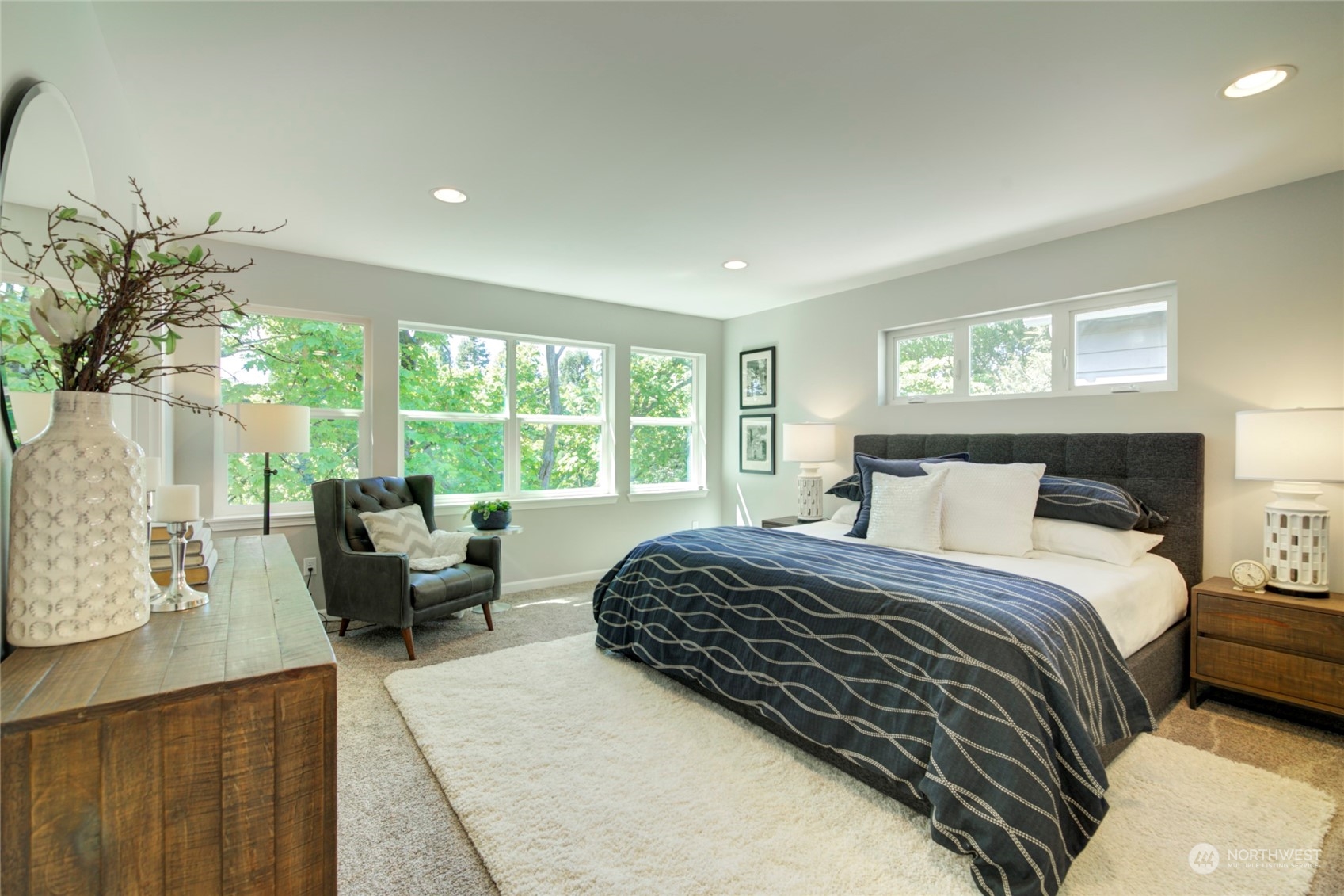 3649 22nd Avenue Southwest Seattle, WA 98106 - Photo 16 of 40 a bedroom with a bed and large windows