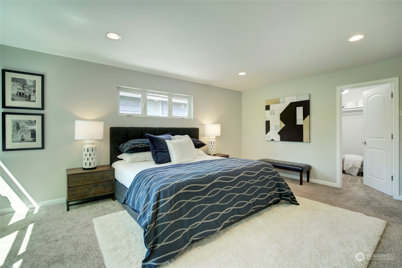 3649 22nd Avenue Southwest Seattle, WA 98106 - Photo 17 of 40 a bedroom with a bed and night stand