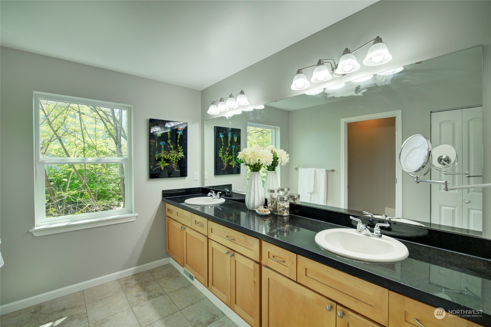 3649 22nd Avenue Southwest Seattle, WA 98106 - Photo 19 of 40 a bathroom with a granite countertop sink a large mirror and a window