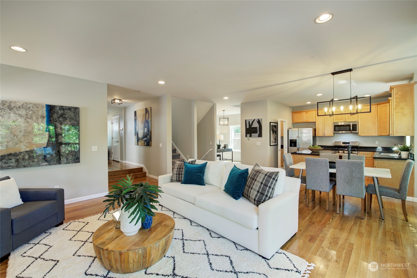 3649 22nd Avenue Southwest Seattle, WA 98106 - Photo 3 of 40 a living room with furniture and kitchen view